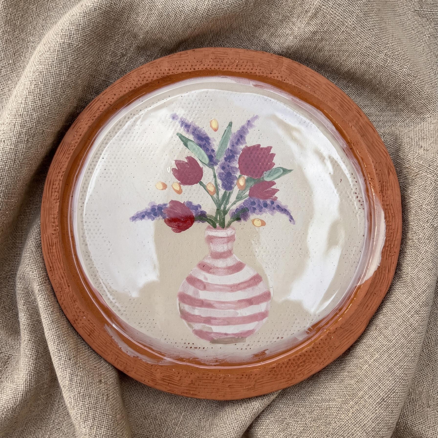 Tulips in a striped vase